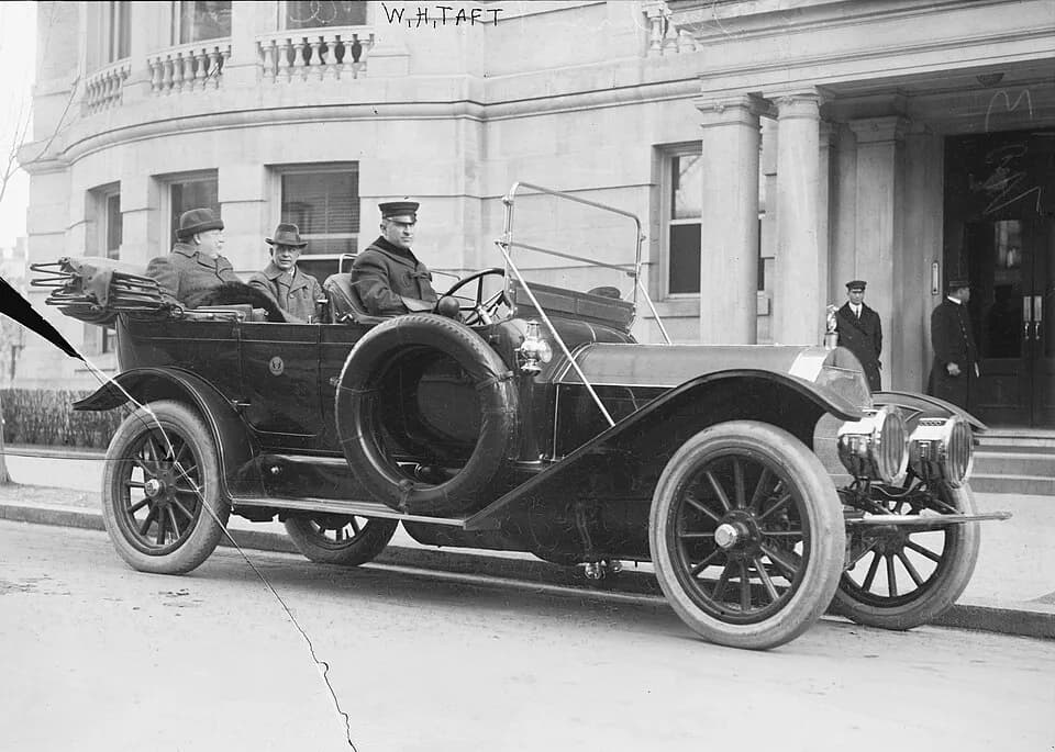 William Howard Taft - U. S. President William Howard Taft (seated in back right of the car; at left of photo) in his Pierce-Arrow touring car.

Unidentified man seated next to President Taft. The driv