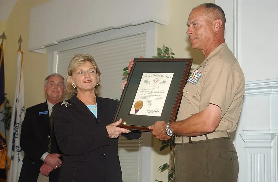 Maya Angelou - MARINE CORPS BASE CAMP LEJEUNE, N.C. - Lieutenant Gov. Beverly Purdue presents Maj. Gen. Robert C. Dickerson, commanding general, Marine Corps Base, with the Long Leaf Pine award for hi