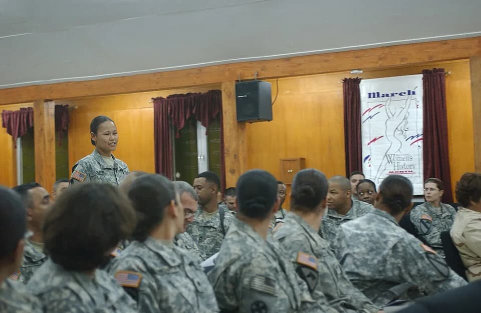 Maya Angelou - Spc. Magdalena Coleon, a native of Honolulu, with Company A., Special Troops Battalion, 1st Cavalry Division, recites the poem, "Phenomenal Woman," by Maya Angelou, as she walks down th
