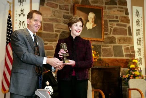 Pearl S. Buck - John Long, Chairman of the Board of Directors, Pearl S. Buck International, presents Mrs. Laura Bush with the 2006 Pearl S. Buck Woman of the Year award Tuesday, October 24, 2006, at t