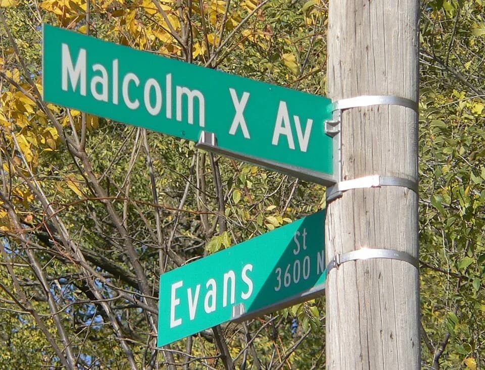 Malcolm X - Street sign marking Malcolm X Avenue and Evans Street in Omaha, Nebraska. The intersection is near the Malcolm X House Site.