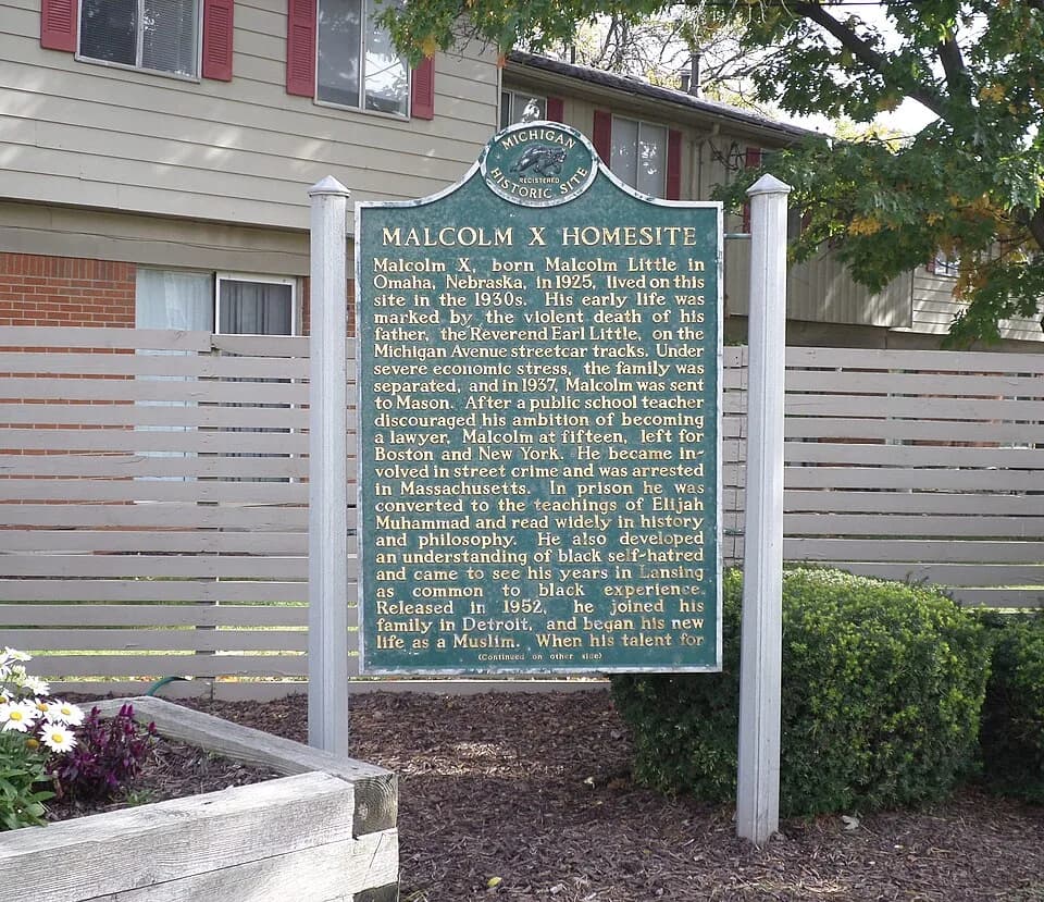 Malcolm X - A plaque commemorating the home of Malcolm X, located at S Martin Luther King Jr Ave and Vincent Ct, Lansing, MI.