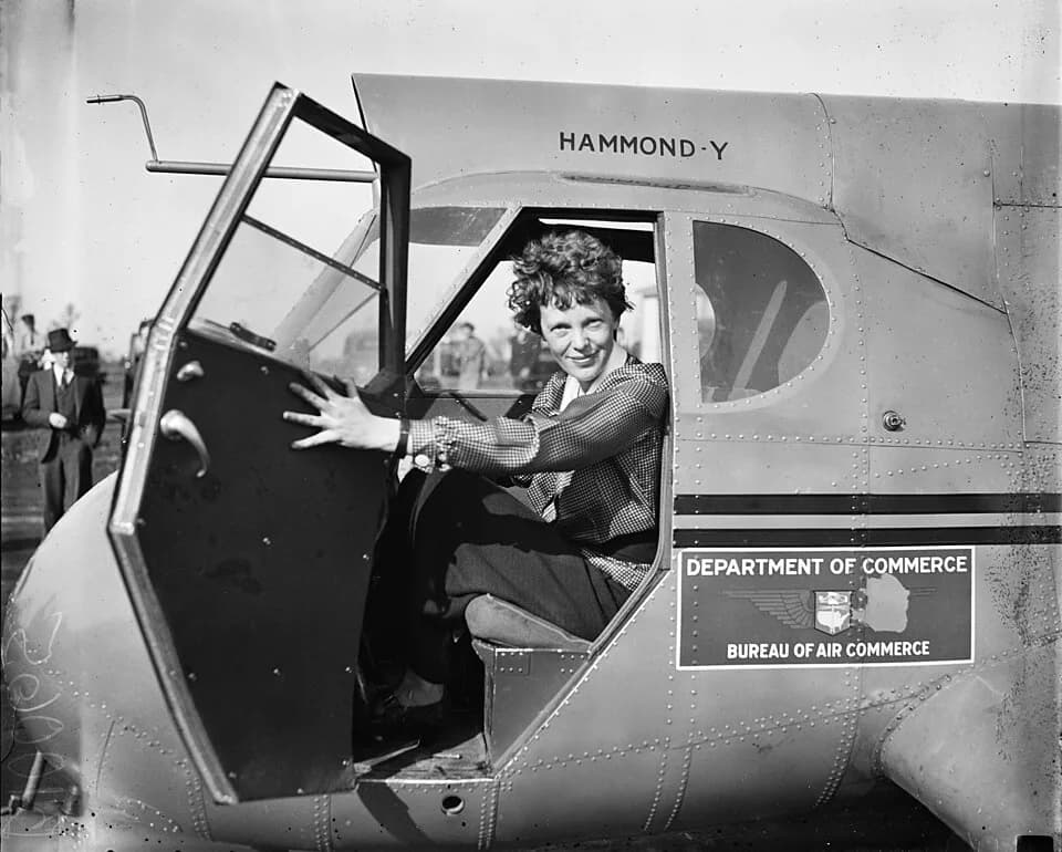 Amelia Earhart - [Amelia Earhart in airplane]