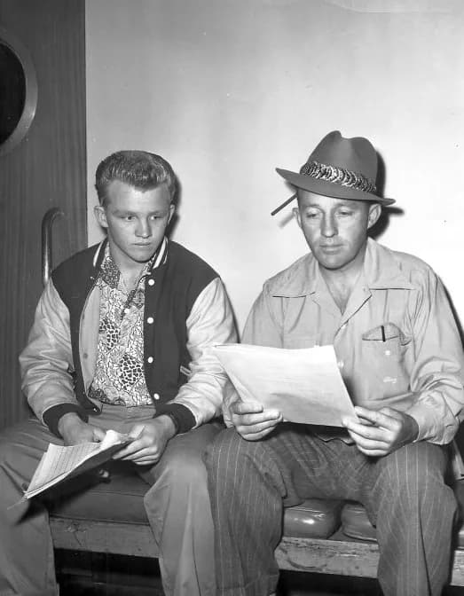 Bing Crosby - Publicity photo of Bing Crosby and his oldest son, Gary, reading a script from Bing's radio program.