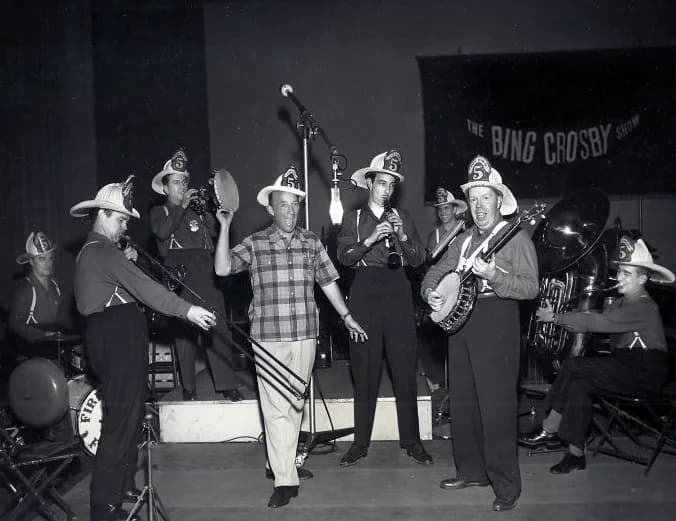 Bing Crosby - Photo of Bing Crosby and the Firehouse Five Plus Two musical group as they appeared on Crosby's CBS Radio program in 1950.