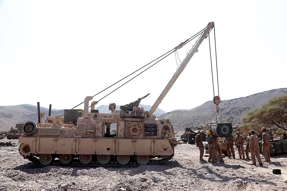 H. P. Lovecraft - U.S. Marines with the 11th Marine Expeditionary Unit (MEU), replace a M1A1 Abrams tank engine with the help of an M88 tank retriever during sustainment training at D’Arta Plage, Djib
