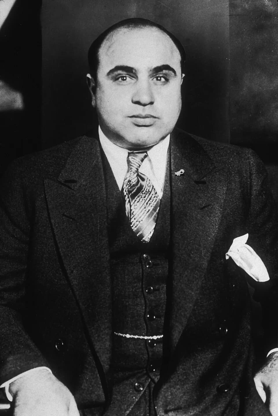 Al Capone - Al Capone sitting.