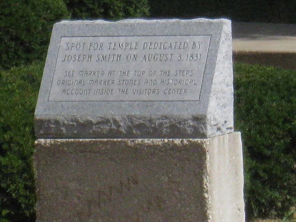 Joseph Smith - View southward of the explanatory monument/marker installed behind (i.e. due west of) the Church of Christ (Hedrickite) headquarters building in the 1990s. This stone marker replaced an