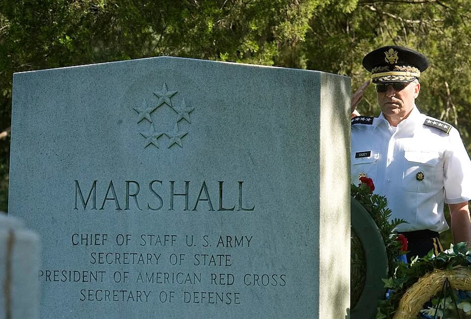 George Marshall - The 36th Chief of Staff of the Army Gen. George W. Casey Jr. salutes
the tombstone of the Army's 15th Chief of Staff Gen. George C.
Marshall at Arlington National Cemetery, Va., on t
