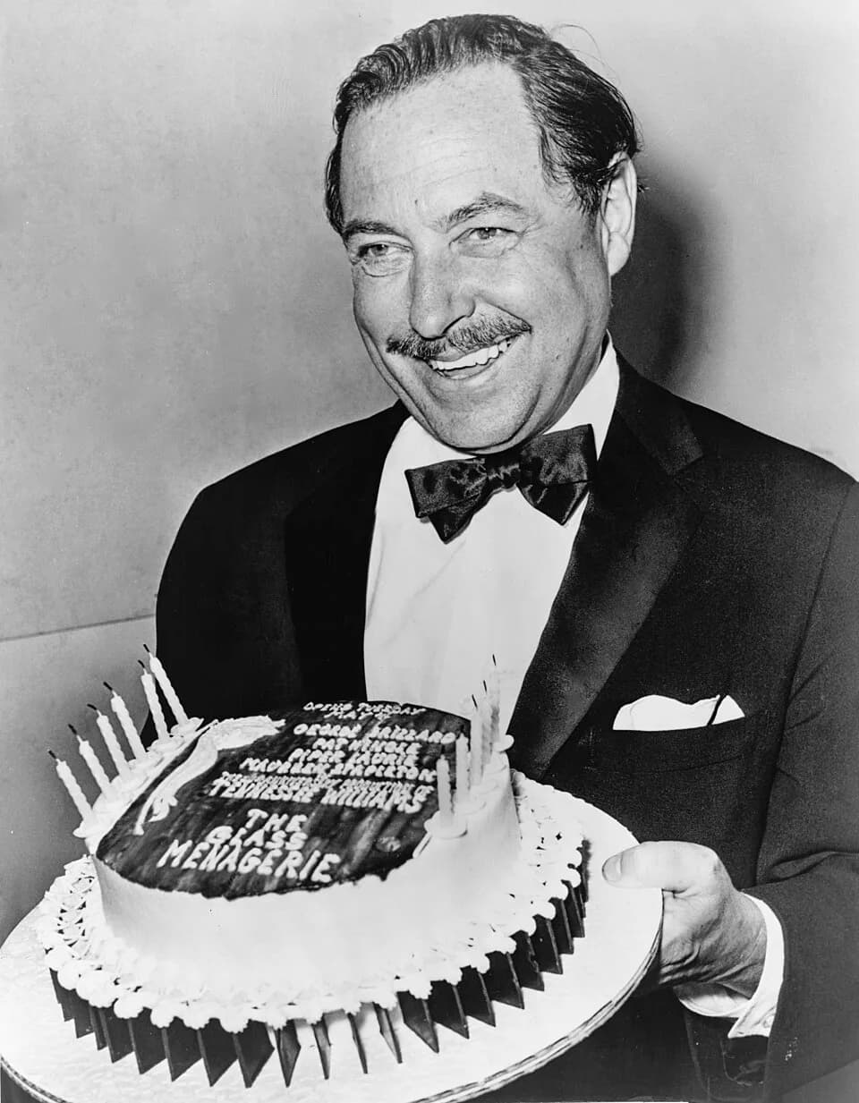 Tennessee Williams - Tennessee Williams with "birthday" cake for the 20th anniversary of "The Glass Menagerie" opening