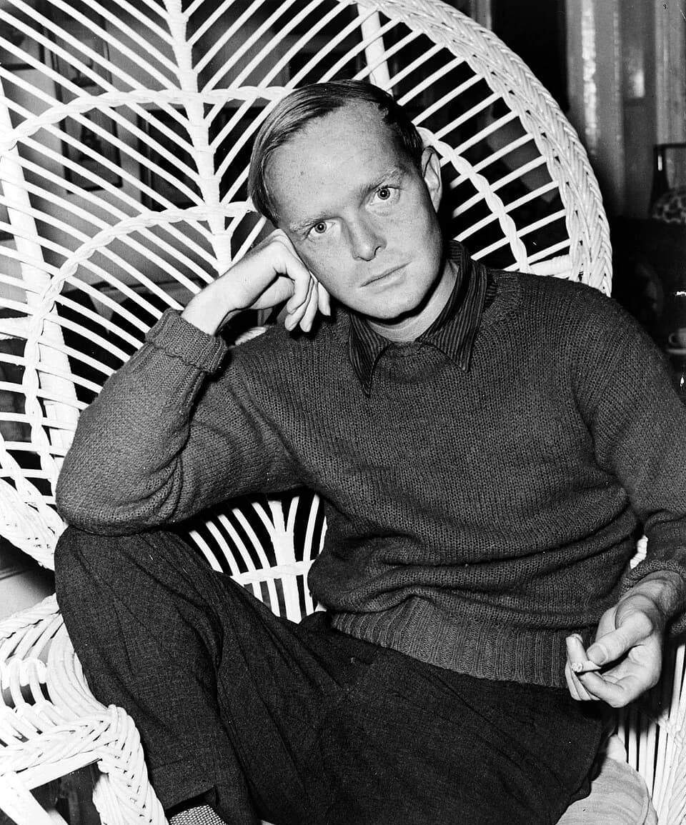 Truman Capote - Truman Capote, half-length portrait, facing front, seated in a chair, resting head on his right hand, holding cigarette in his left hand / World Telegram & Sun photo by Roger Higg