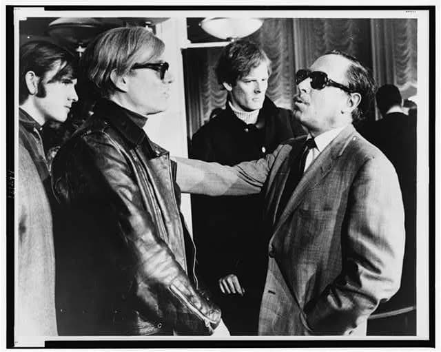 Tennessee Williams - Andy Warhol (left) and Tennessee Williams (right) talking on the S.S. France, in the background: Paul Morrissey. World Journal Tribune photo by James Kavallines.
