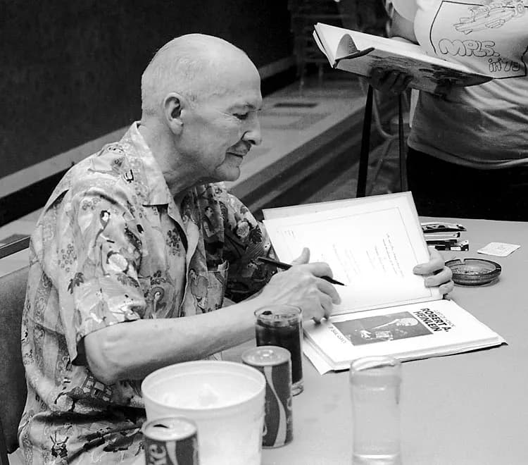 Robert A. Heinlein - Robert A. Heinlein autographing at the 1976 Worldcon (Midmericon)
Photo by Dd-b, taken at the 1976 World Science Fiction Convention in Kansas City MO USA, at which Heinlein was th