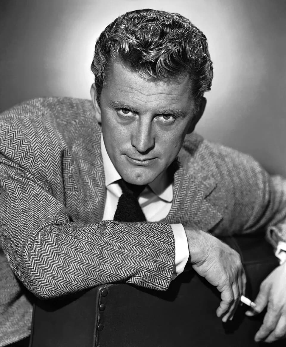 Kirk Douglas - Publicity photo of Kirk Douglas. Original upload has signature. Seller states on their listing that there is nothing printed on the reverse side. See also: film still for copyright info