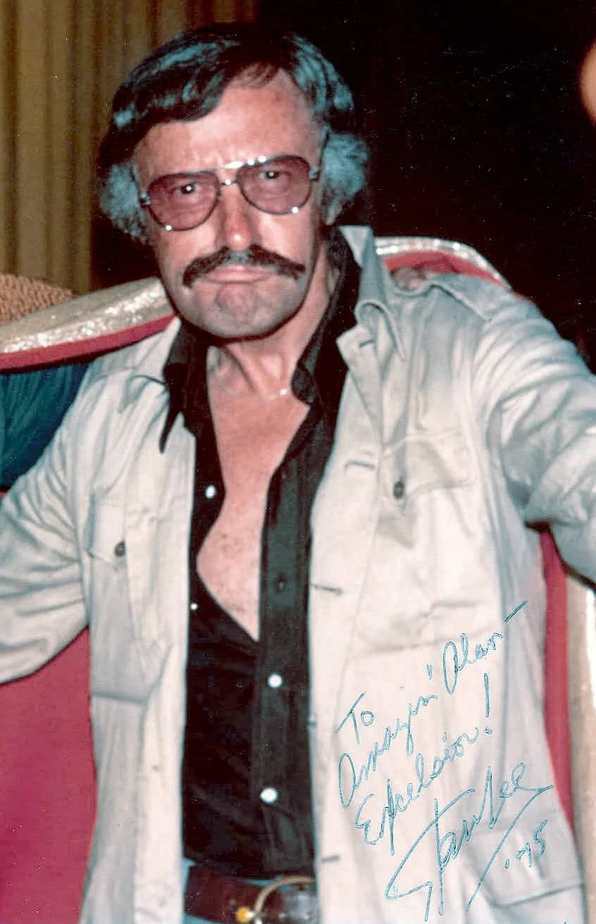 Stan Lee - Photo of Stan Lee at the 1975 San Diego comic con, with the text "To amazin' Alan - Excelsior! Stan Lee '75"