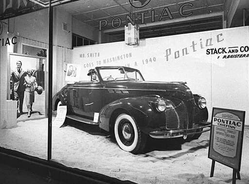James Stewart - Stack &amp; Company automobile dealership on York Street in Sydney, Australia (January 1940). 1940 Pontiac Chieftain in showroom. Image by Sam Hood, from vintage nitrate negative (Stat