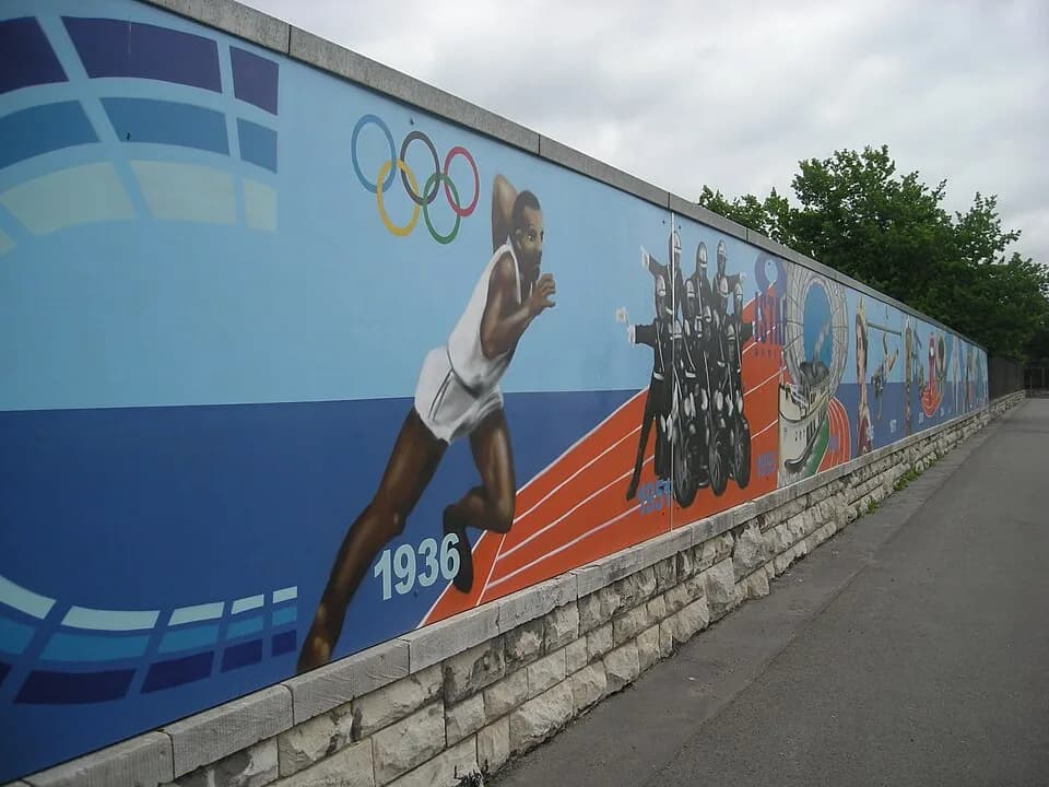 Jesse Owens - Mural (with American track and field athlete Jesse Owens in the foreground) at the Olympiastadion in Berlin (Germany).