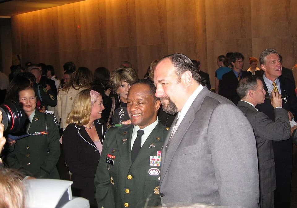 James Gandolfini - Army Col. Casper P. Jones III (left), commander of the 86th Combat Support Hospital, poses with actor James Gandolfini at a screening of the new HBO documentary "Baghdad ER" at the