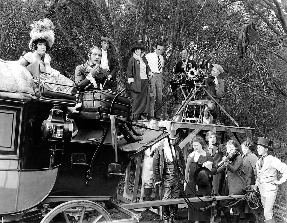 Gloria Swanson - (Top row L. to R.) Gloria Swanson, Rudolph Valentino, unknown, Elinor Glyn, Sam Wood, Alfred Gilks, Osmond Borradaile (Bottom row) All unknown except Alec B. Francis (far right), on t