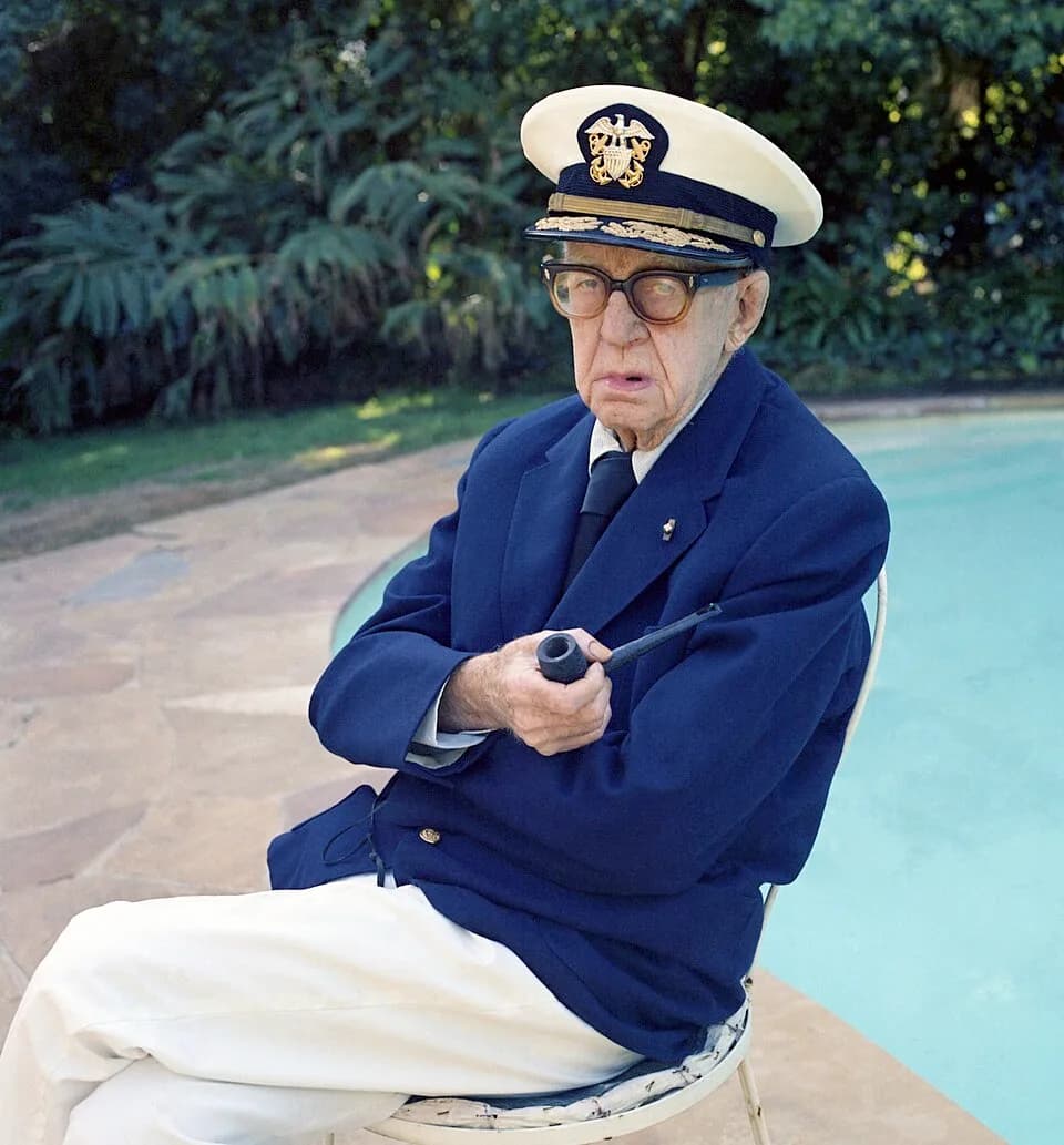 John Ford - John Ford by his Pool in Bel Air dressed in his Admirals uniform.