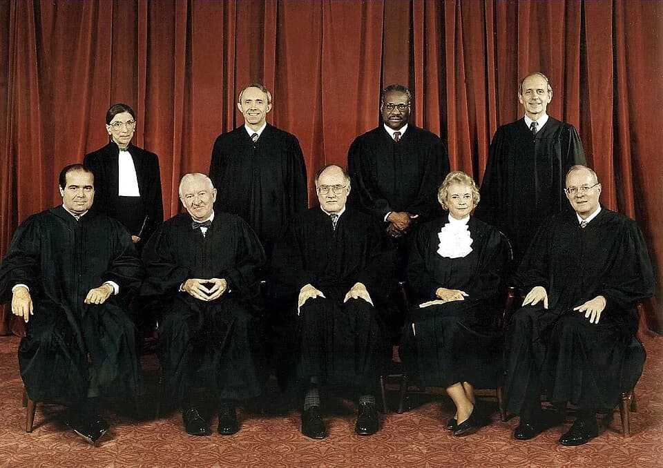 Ruth Bader Ginsburg - United States Supreme Court, 1994-2005.
Back row (left to right): w:Ruth Bader Ginsburg, w:David Hackett Souter, w:Clarence Thomas, w:Stephen Breyer;
Front row (left to right): w