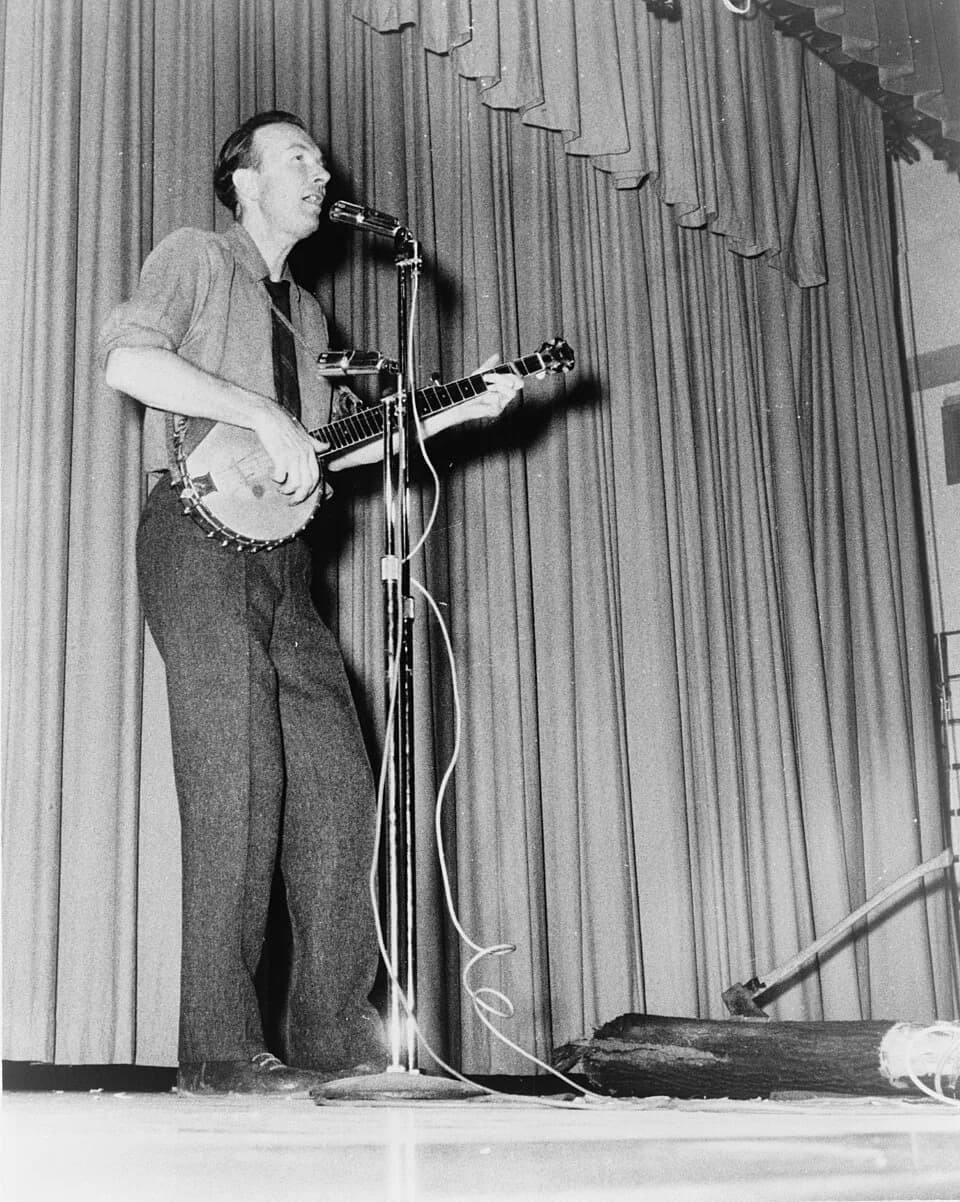 Pete Seeger - Pete Seeger, full-length portrait, performing on stage at Yorktown Heights High School, Yorktown, N.Y. / World Journal Tribune photo by James Kavallines.