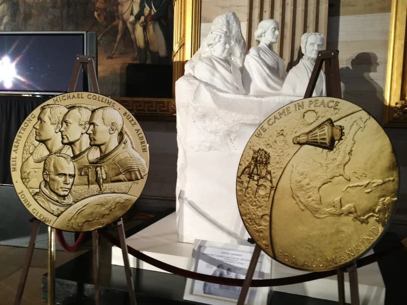 John Glenn - The New Frontier Congressional Gold Medal was presented to NASA astronauts Neil Armstrong, Buzz Aldrin, Michael Collins, and John Glenn by leaders of the US Congress on 16 November 2011.
