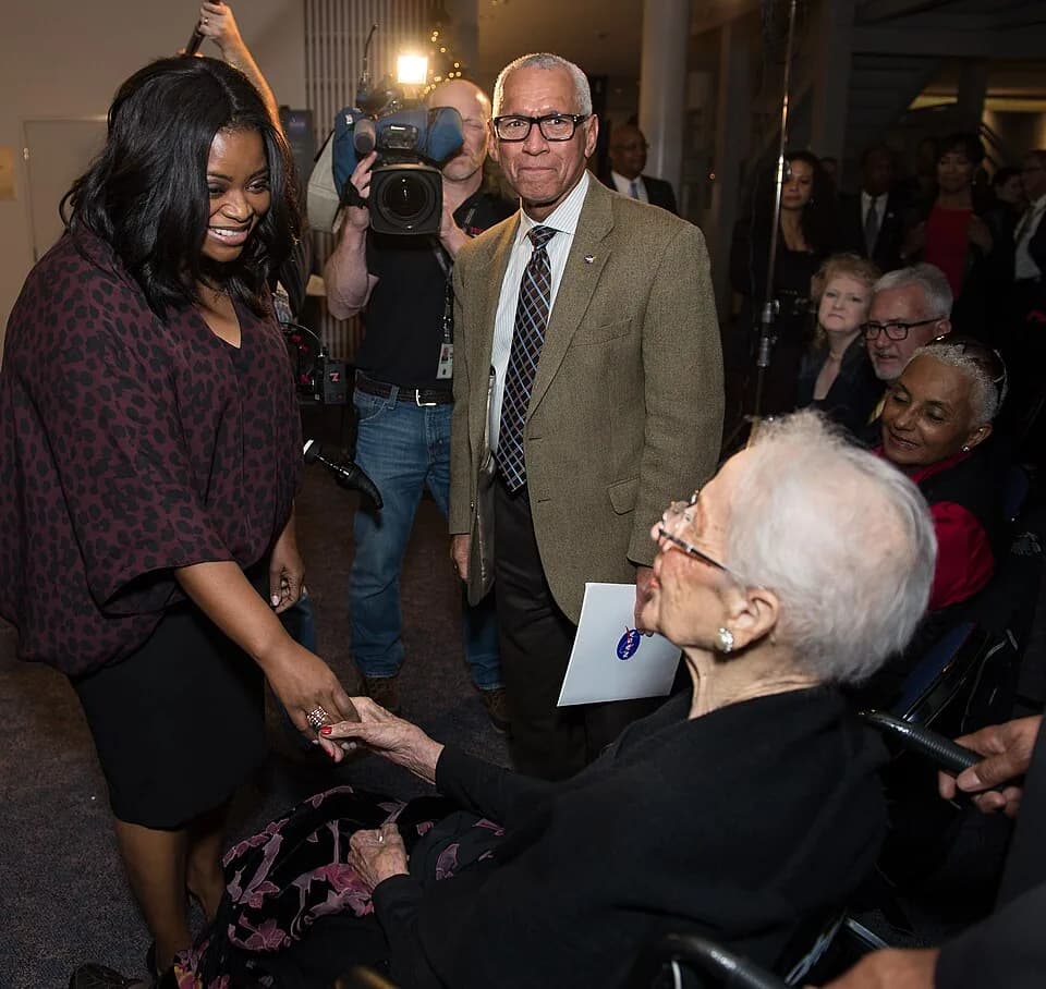Katherine Johnson - Actress Octavia Spencer, left, who plays Dorothy Vaughan in the film "Hidden Figures" and NASA Administrator Charles Bolden, right, greets NASA "human computer" Katherine Johnson, 