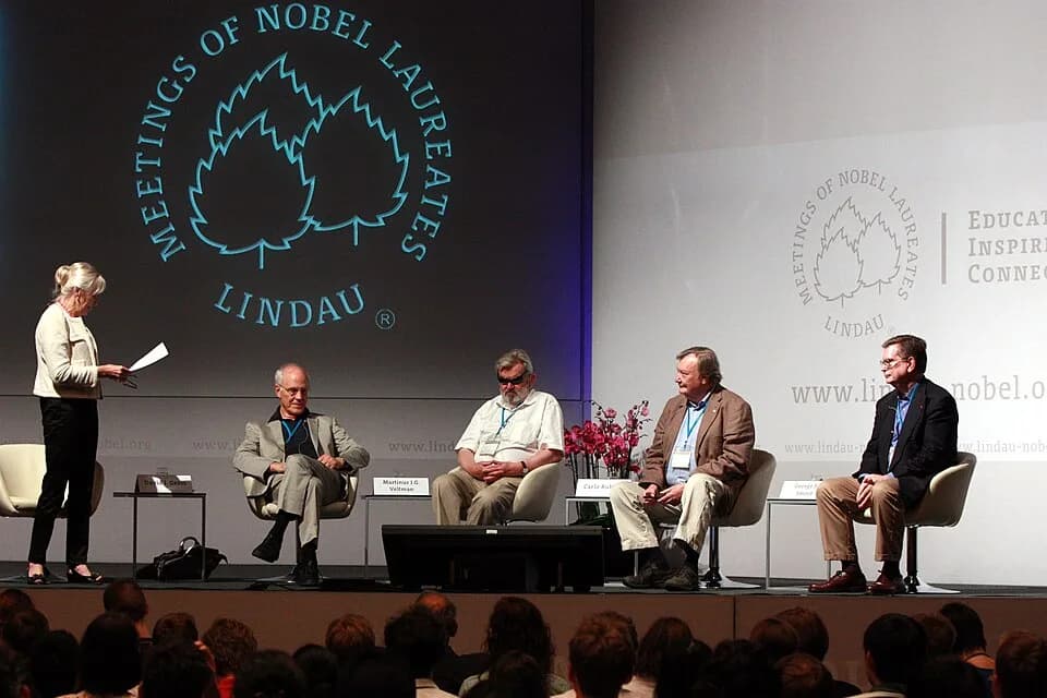 George F. Smoot - Panel discussion on the Higgs particle results from CERN at the 2012 Lindau Nobel Laureate Meeting. Seated from left to right: David Gross, Martinus Veltman, Carlo Rubbia, and George