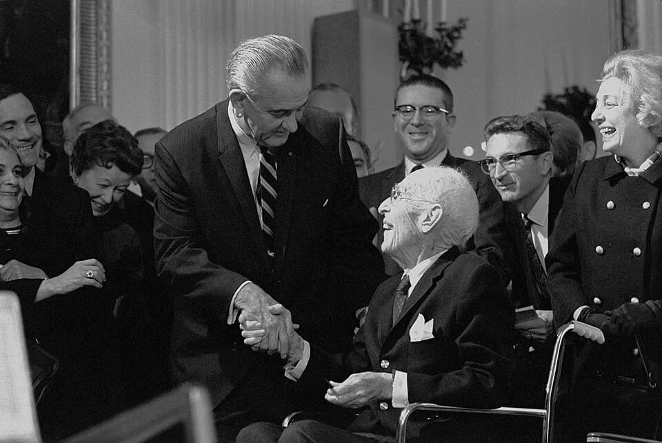 Upton Sinclair - President Lyndon B. Johnson greets Upton Sinclair as others look on.