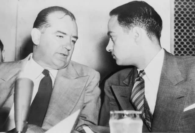 Joseph McCarthy - Sen. Joseph McCarthy chats with his attorney Roy Cohn during Senate Subcommittee hearings on the McCarthy-Army dispute