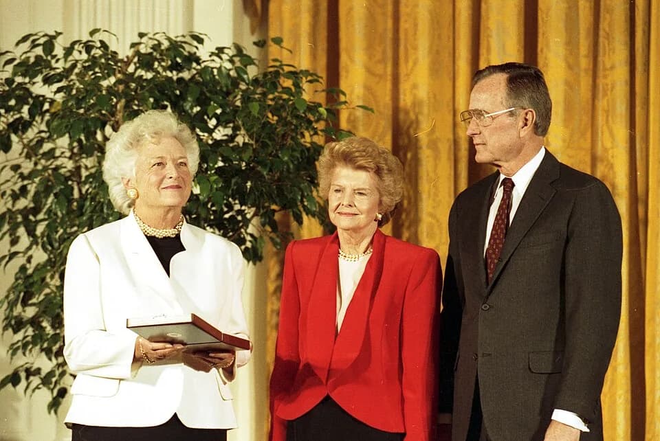 Betty Ford - Former First Lady Betty Ford receives the nation's highest honor, the Presidential Medal of Freedom, from President George H. W. Bush. Holding the medal is First Lady Barbara Bush.