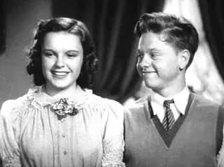 Mickey Rooney - Cropped screenshot of Judy Garland and Mickey Rooney from the trailer for the film Love Finds Andy Hardy.