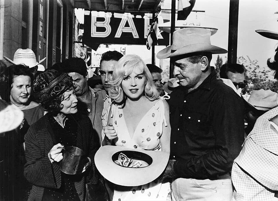 John Huston - Photo of Marilyn Monroe in the Misfits from the May 1961 issue of TV-Radio Mirror.
Note this is a larger, better quality uncropped copy of the photo seen on Radio-TV Mirror page 23.
A re
