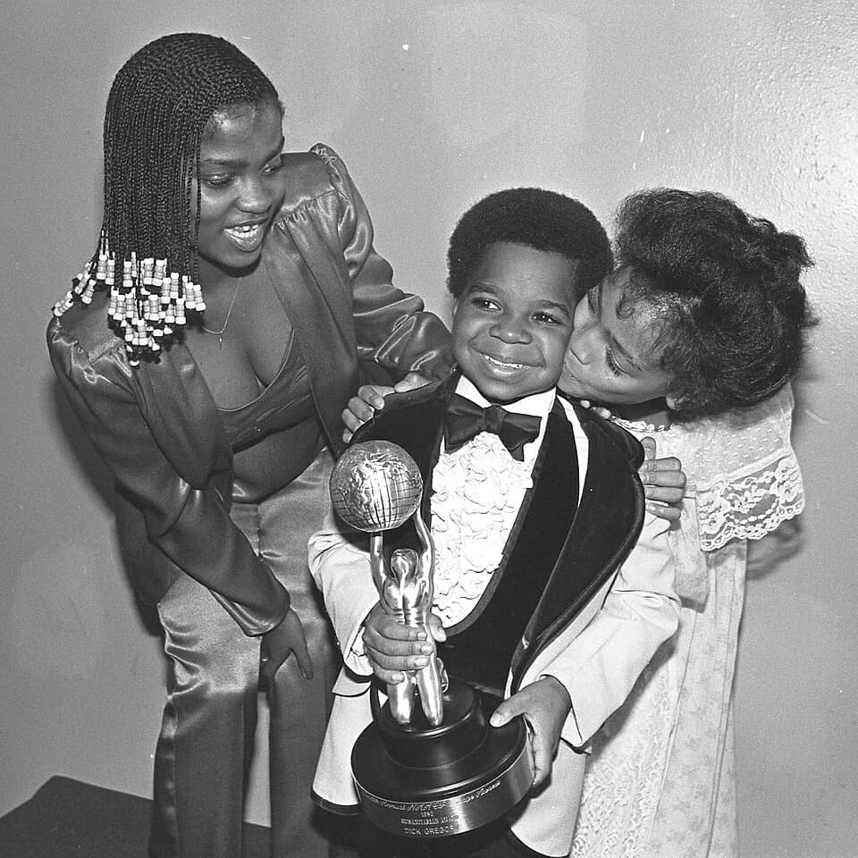 Gary Coleman - Gary Coleman holds his NAACP Image Award for the TV movie "Kid From Left Field" in which he starred. Looking on are Danielle Spencer, left, of "What's Happening," and Kim Fields of "The