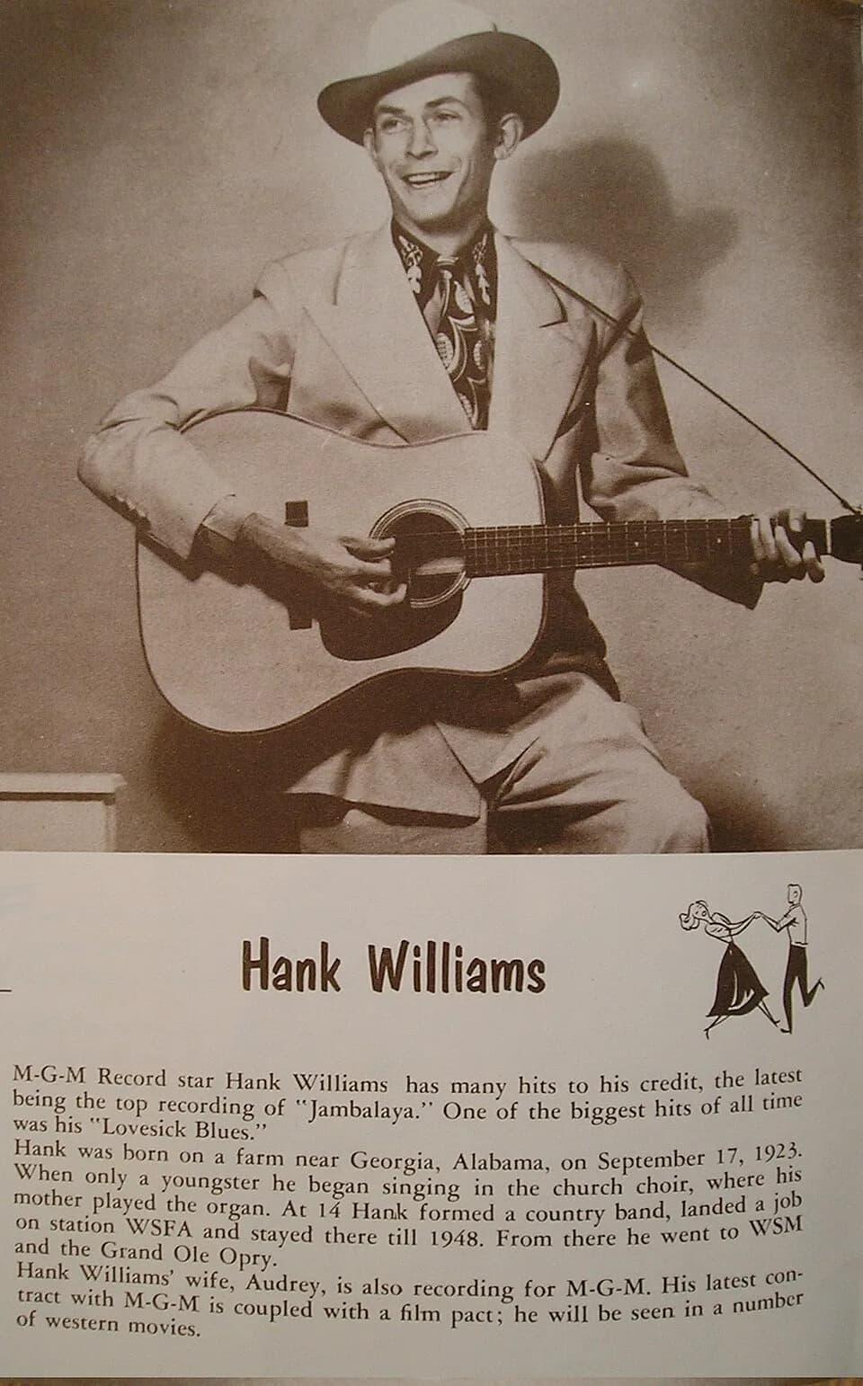 Hank Williams - Hank Williams playing a guitar. MGM publicity shot.
