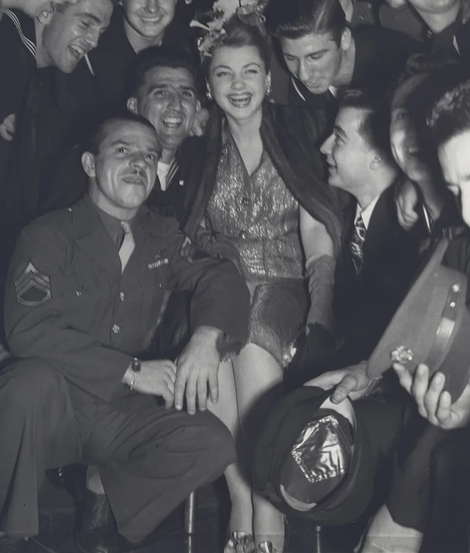 Anne Baxter - Anne Baxter in 1943 pose with United States Army soldiers
Photograph by the U.S. Army Signal Corps