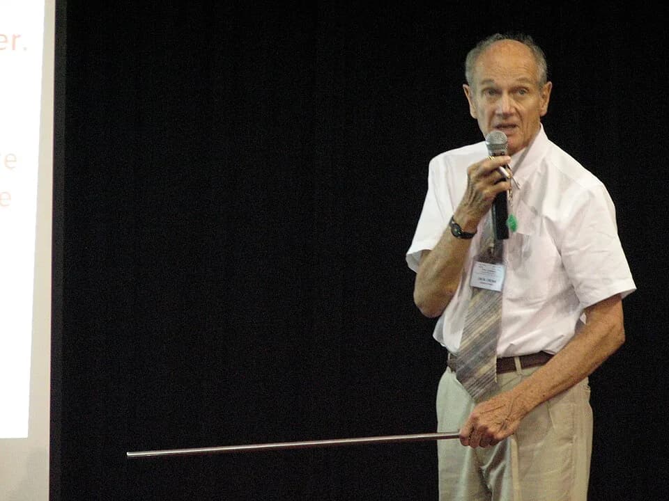 James Cronin - American nuclear physicist James Watson Cronin, 1980 Nobel Prize in Physics, giving a scientific presentation at Vietnam National University, Hanoi, Vietnam on August 4th, 2006.