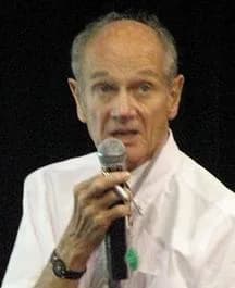 James Cronin - American nuclear physicist James Watson Cronin, 1980 Nobel Prize in Physics, giving a scientific presentation at Vietnam National University, Hanoi, Vietnam on August 4th, 2006.