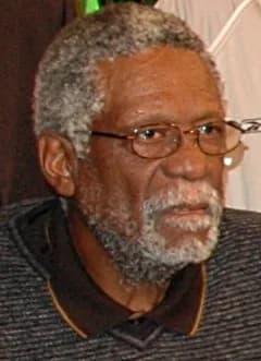 Bill Russell - Bill Russell posing with other NBA Legends and the NBA Championship Trophy (not shown) for the 2005 NBA Legends Tour: Destination Finals kick off held at the NBA store. The Tour visited