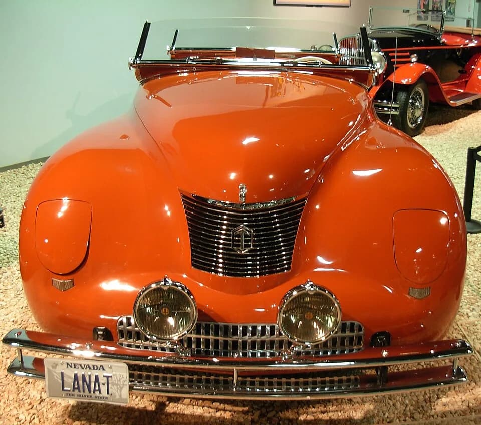 Lana Turner - MODEL Newport Dual Cowl Phaeton 
BUILT BY Chrysler Corporation Detroit, Michigan 
BODY BY Le Baron 
PRICE $4,725 
ENGINE 8 Cylinder, 137 H.P. 
BORE 3-1/4" 
STROKE 4-7/8" 
DISPLACEMENT 32