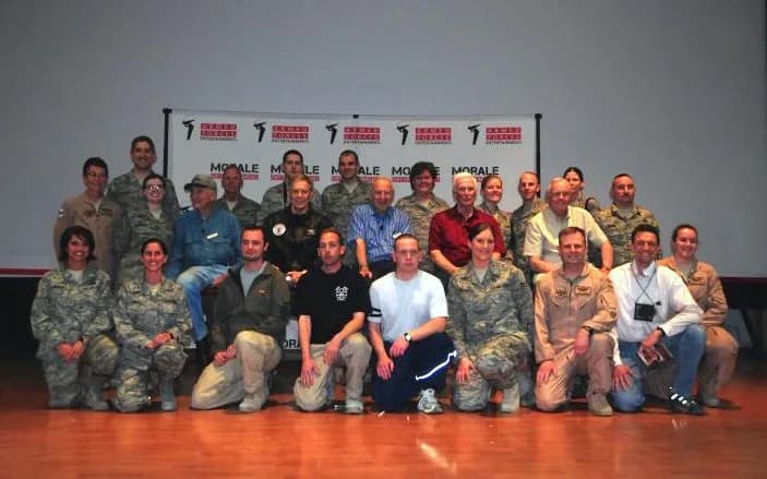 Jim Lovell - middle row Edwin "Buzz" Aldrin (6th from right), Jim Lovell (4th from right), Gene Cernan (3rd from right), Neil Armstrong (2nd from right), with U.S. Air Force members in Kuwait during a