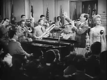 Benny Goodman - Cropped screenshot of Benny Goodman and his band, with featured vocalist Peggy Lee from the film Stage Door Canteen.