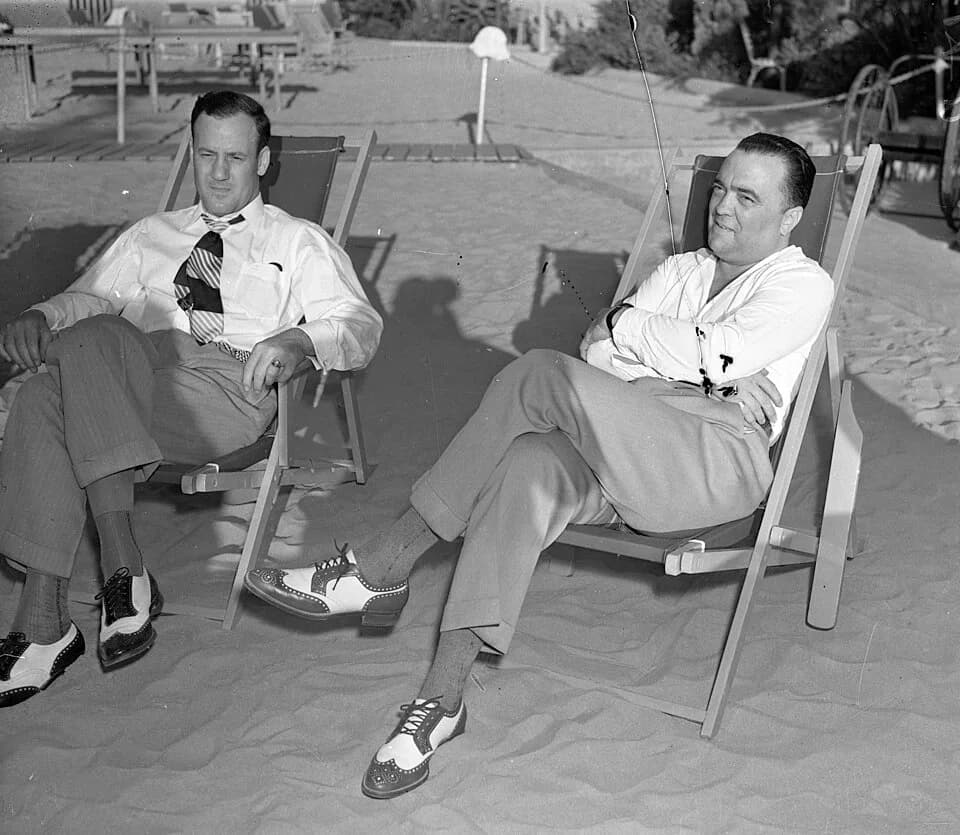 J. Edgar Hoover - Title:  J. Edgar Hoover and his assistant Clyde Tolson sitting in beach lounge chairs, circa 1939