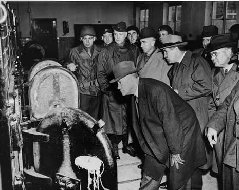 Alben W. Barkley - American congressmen view the open ovens in the Buchenwald crematorium during an inspection of the newly liberated concentration camp. Pictured from left to right are: Senator Alben