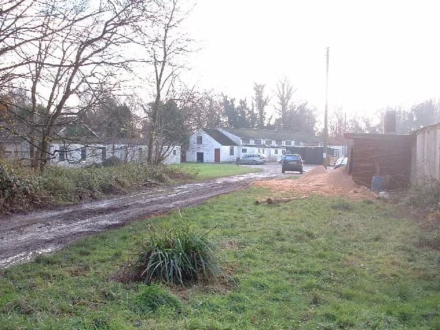 Glenn Miller - Leedsgate Farm, Bedford Purlieus Woods. The building in the centre background was the gym, cinema and chapel for RAF Kings Cliffe and was the last place that Glen Miller played before h