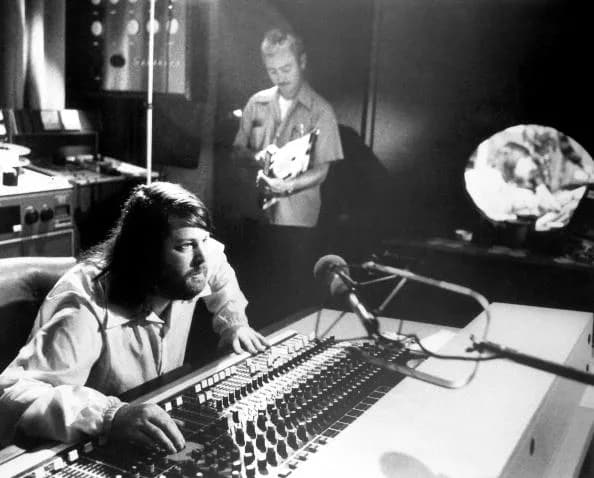 Brian Wilson - 1976 promotional photo of Brian Wilson behind a mixing board.