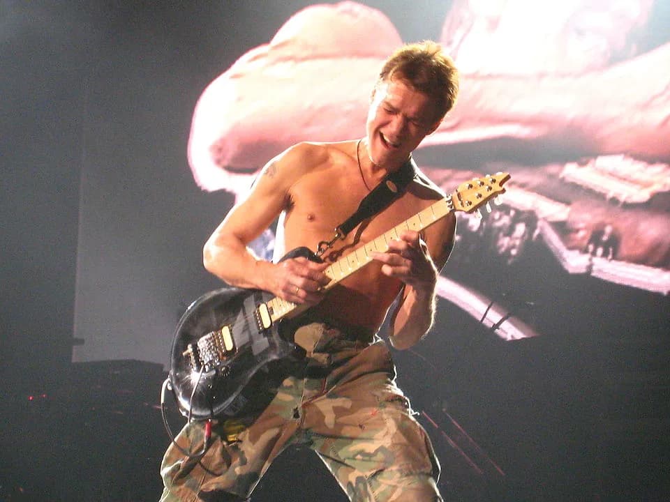 Eddie Van Halen - Eddie Van Halen shredding his guitar while playing Eruption. 

Taken at The Van Halen Tour featuring David Lee Roth (lead vocals), Eddie Van Halen (guitars), Wolfgang Van Halen (bass