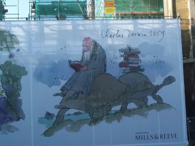 Charles Darwin - Charles Darwin by Quentin Blake. This cartoon by Quentin Blake adorns the front wall of Kings College, hiding the building works.
For position, see 1585253.