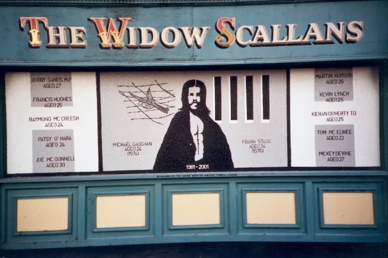 Bobby Sands - This is a mural representing Bobby Sands, an Irish national hero who died after undertaking a hunger strike (together with other IRA members held prisoners, whose names appear on the sid